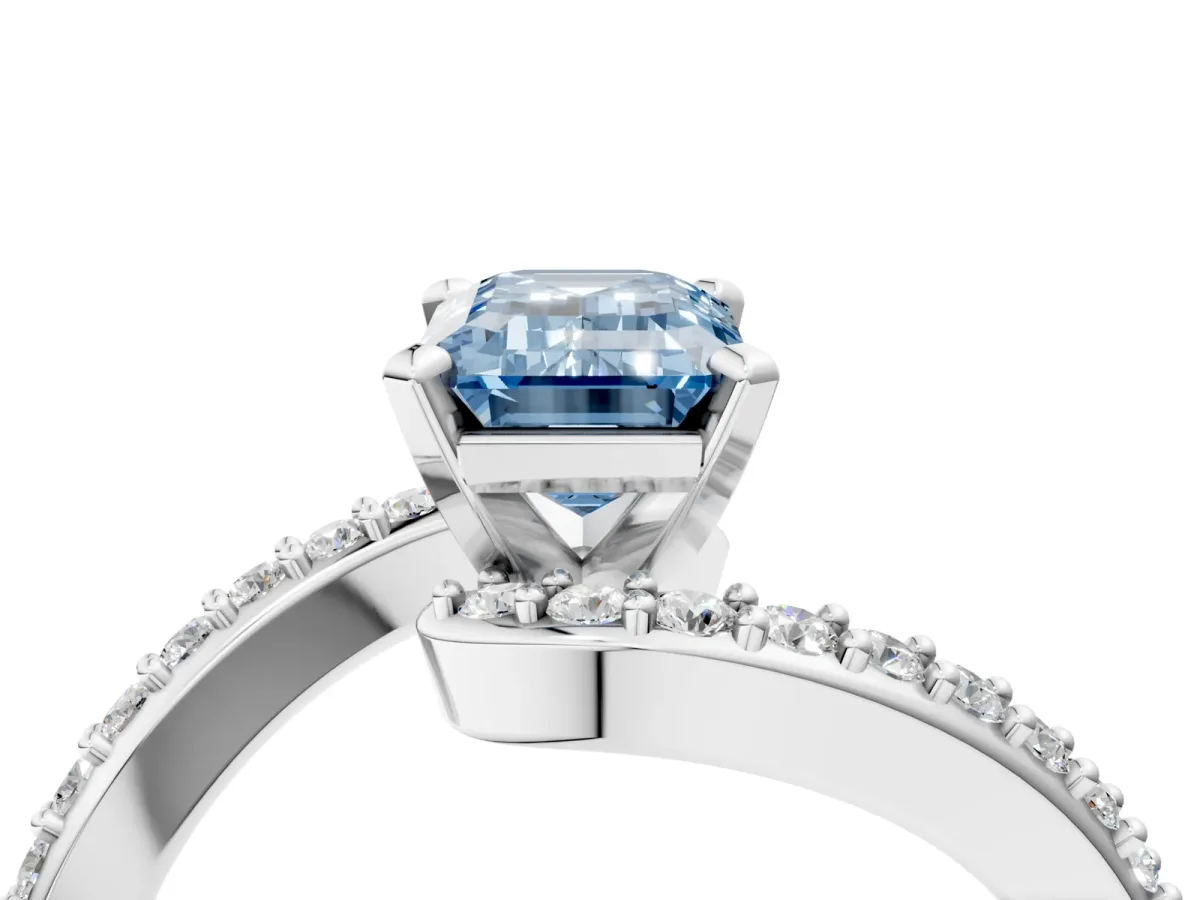 Fancy Blue Emerald Cut Solitaire Twist Band with Pave Set Diamonds and Four-Prong Setting Platinum