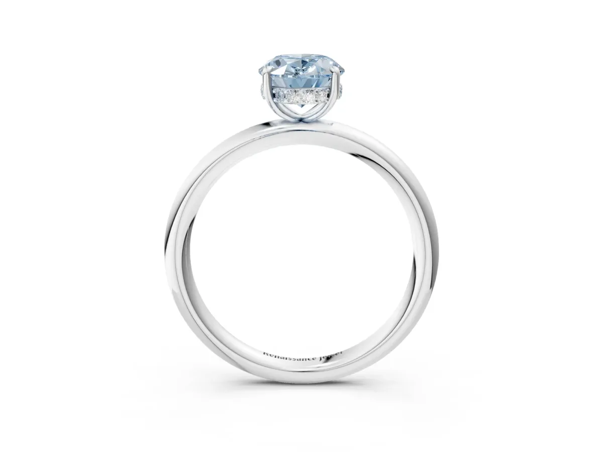 Fancy Blue Oval Cut Diamond Solitaire Ring with Thin Band and Four-Prong Setting White gold