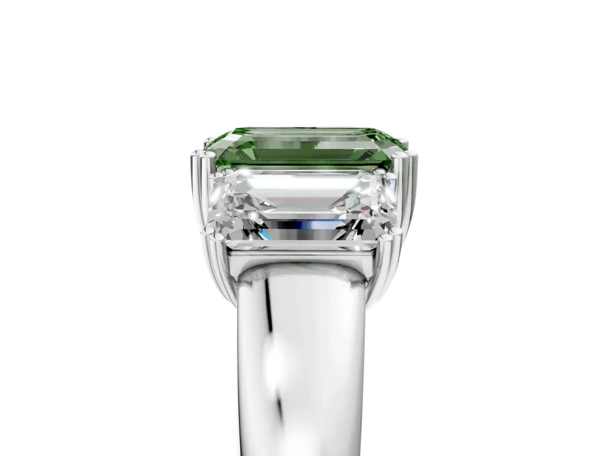 Fancy Green Three-Stone Emerald Cut Cut Diamond Ring with Channel Set Band and Four-Prong Setting Platinum