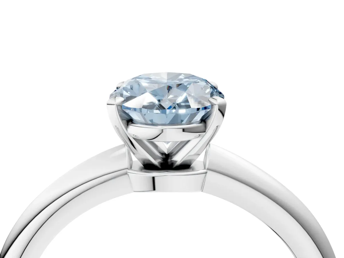 Fancy Blue Oval Cut Diamond Solitaire Ring with Six-Prong Setting and Classic Band Platinum