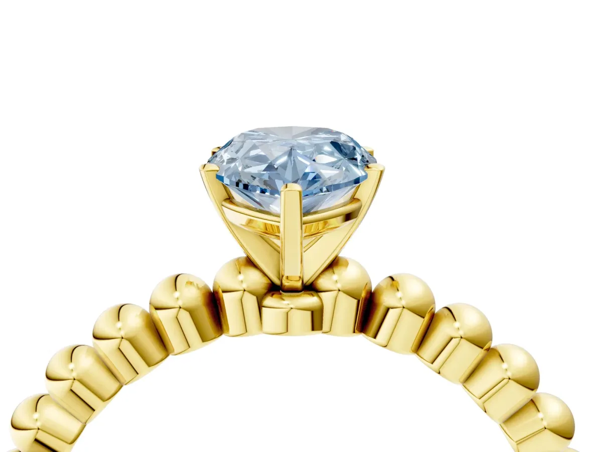 Fancy Blue Pear Cut Diamond Solitaire Ring with Beaded Band and Prong Setting Yellow gold