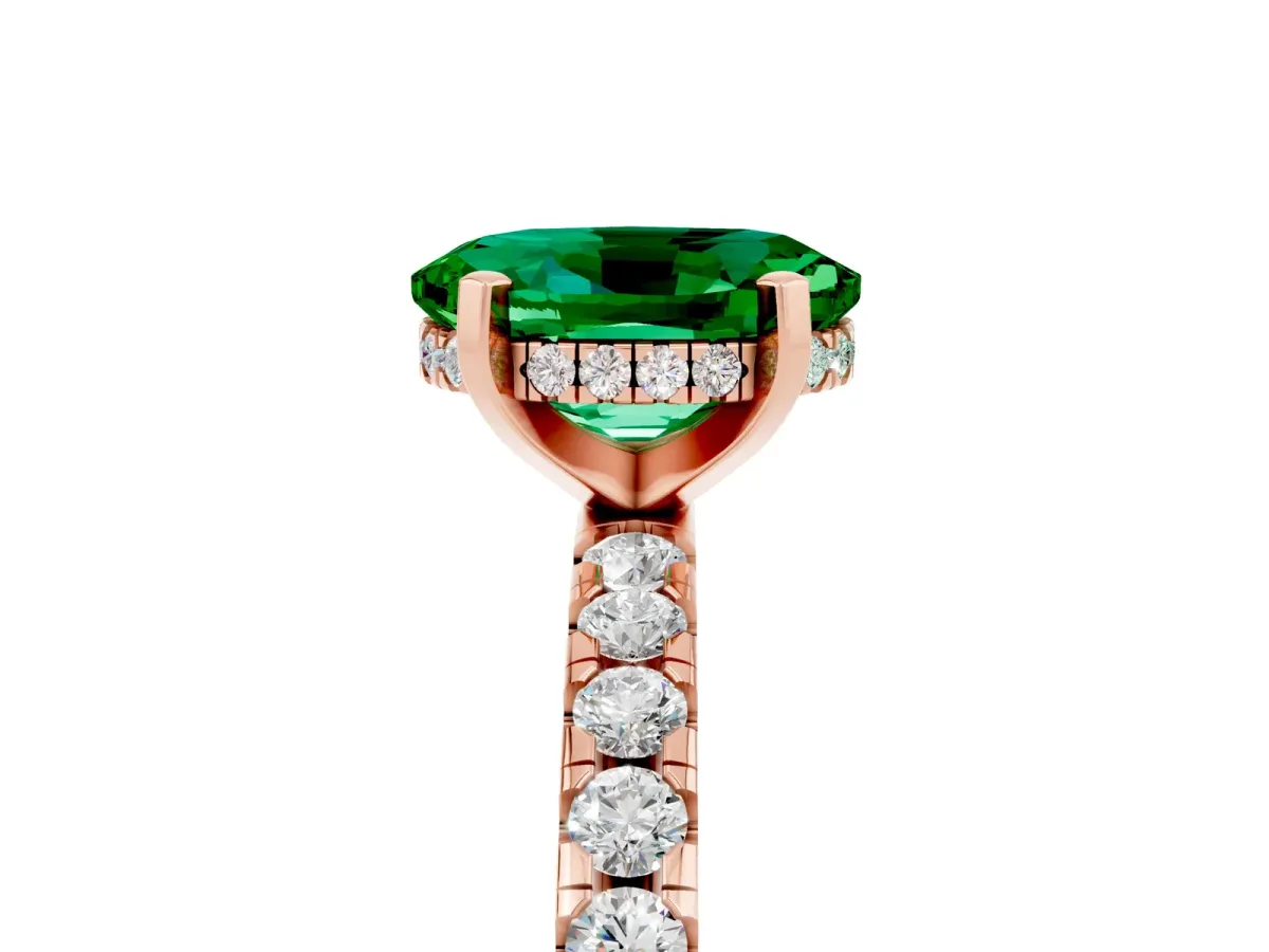 Oval Cut Emerald Solitaire Ring with Round Pavé Band and Four-Prong Setting Rose gold