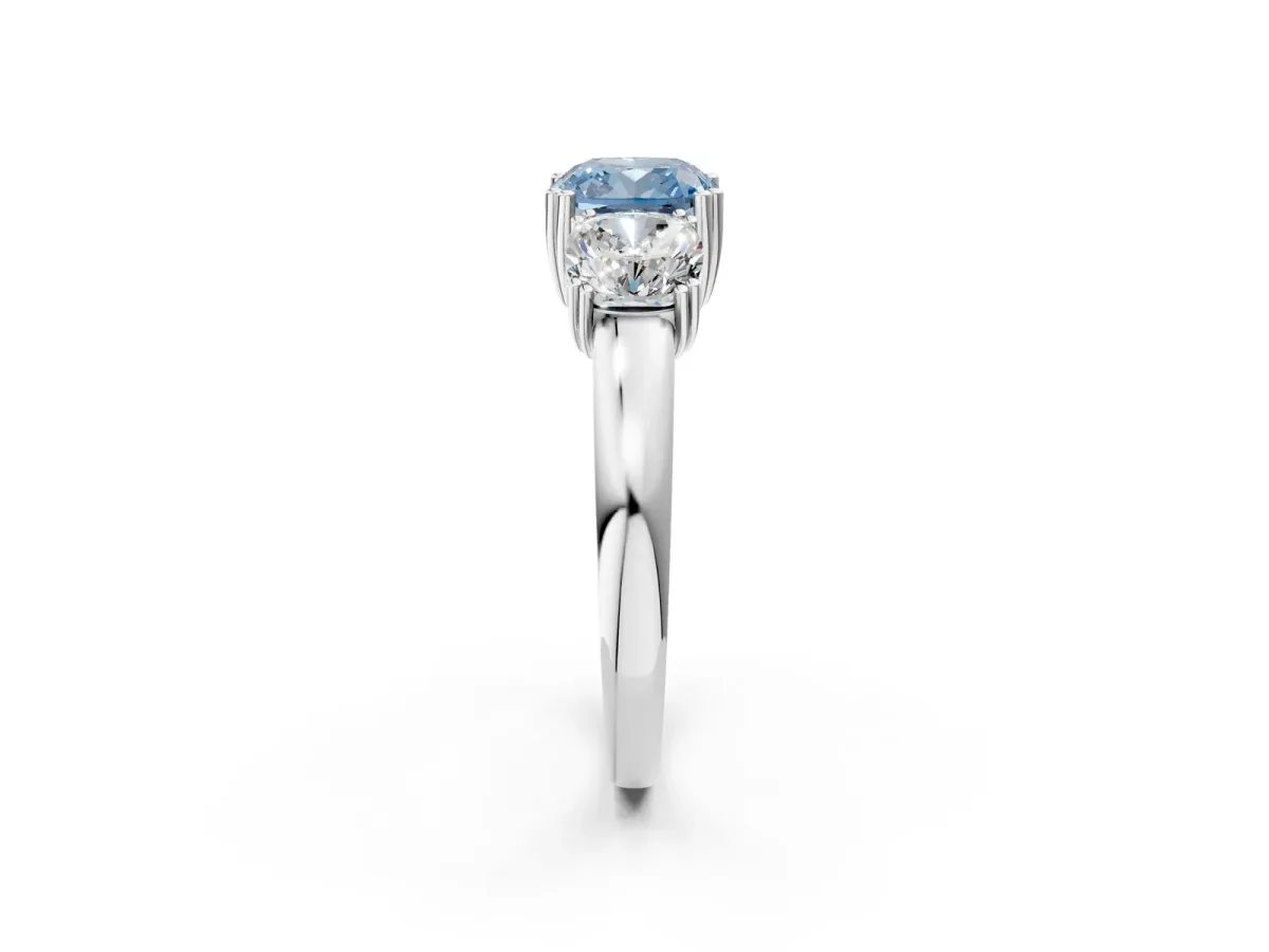 Fancy Blue Three-Stone Cushion Cut Cut Diamond Ring with Channel Set Band and Four-Prong Setting Silver
