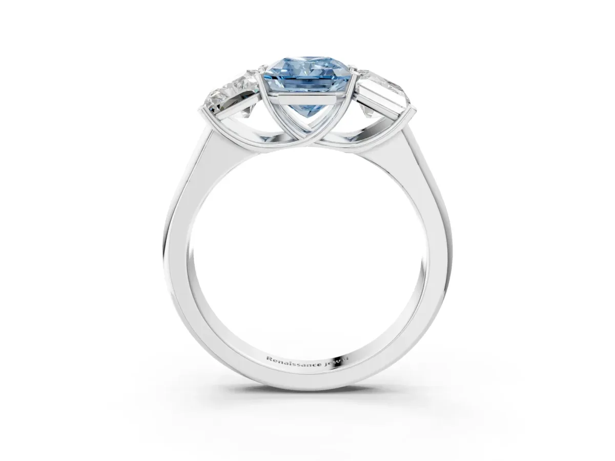 Fancy Blue Radiant Cut Three-Stone Diamond Ring with Prong Setting on a Classic Band Platinum
