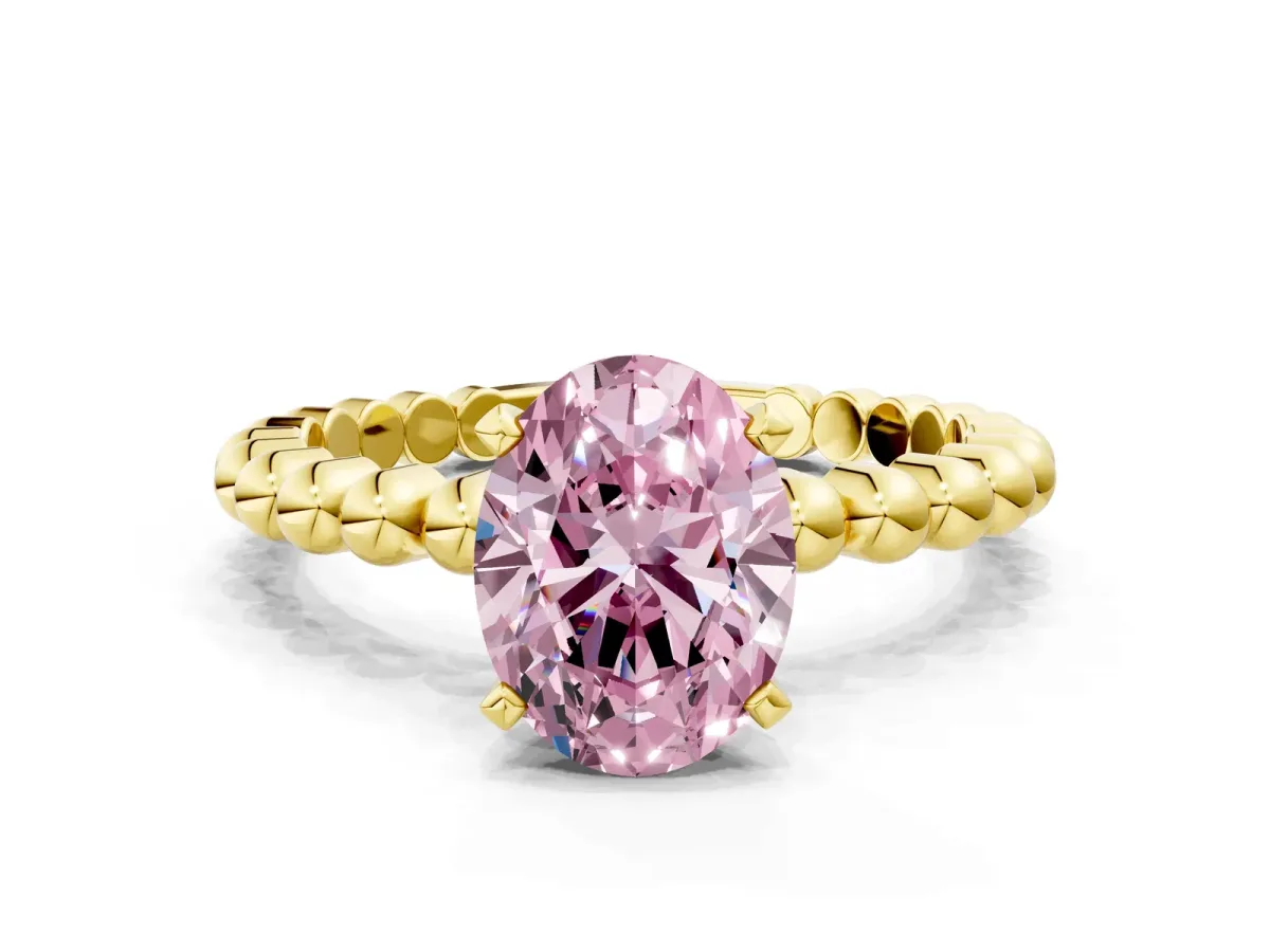 Fancy Pink Oval Cut Diamond Solitaire Ring with Beaded Band and Prong Setting Yellow gold