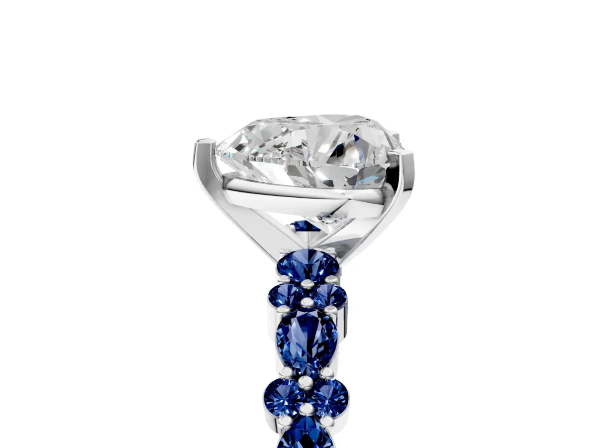 Heart Cut Diamond Side Stone Solitaire Ring with Round Blue Sapphire and Four-Prong Setting Platinum