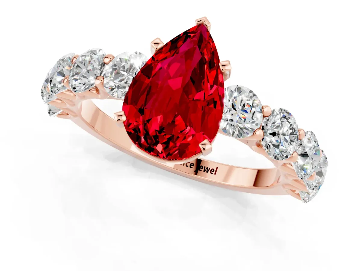 Pear Cut Ruby Prong Setting with Side Stones on a Pave Band Rose gold