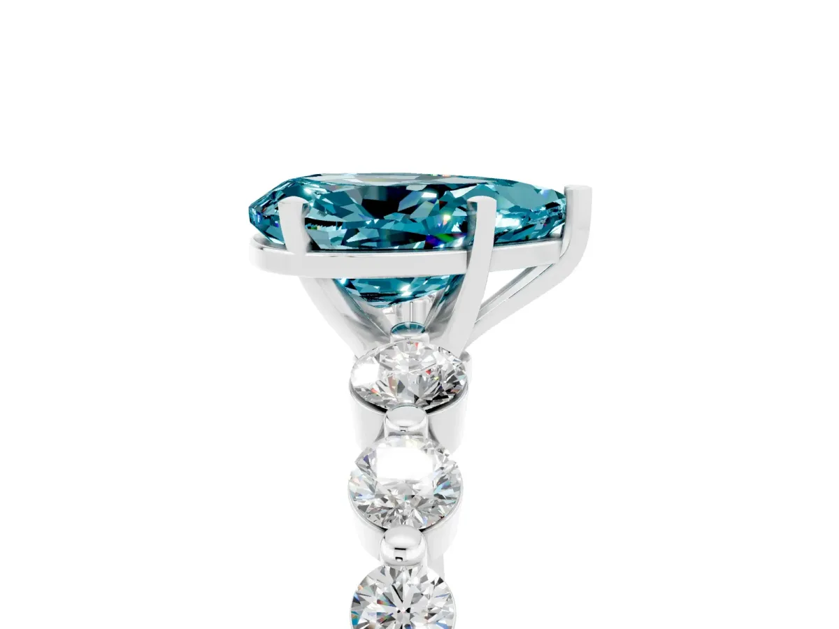 Pear Cut Solitaire Blue Topaz Ring with Pave Band and Four-Prong Setting Silver
