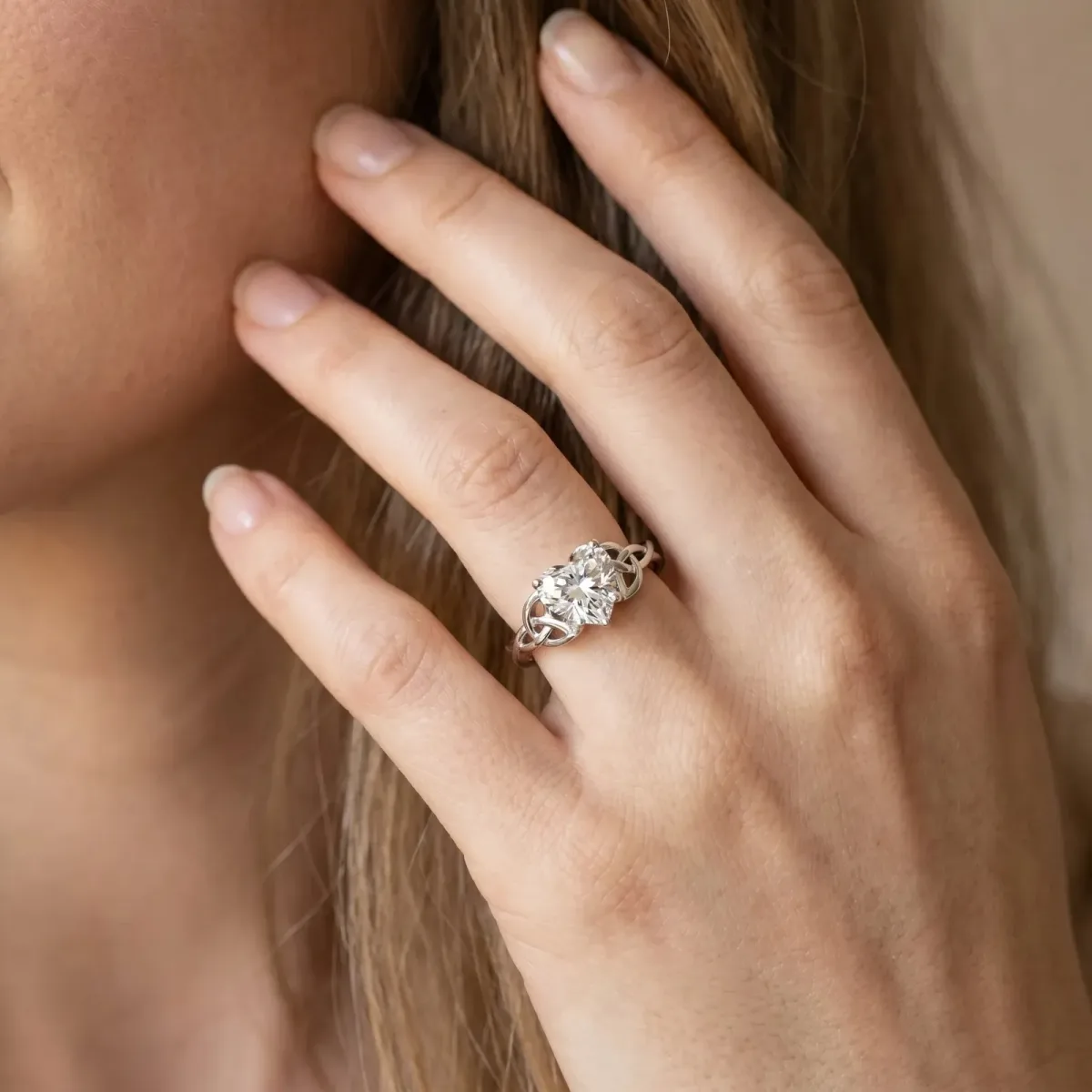 Heart Cut Diamond Solitaire Engagement Ring with Celtic Knot Band and Four-Prong Setting Silver