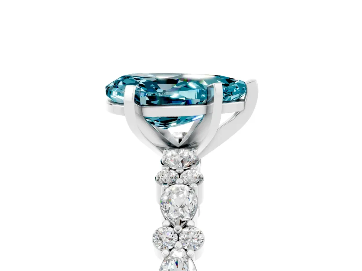 Pear Cut Blue Topaz Side Stone Solitaire Ring with Round and Four-Prong Setting White gold