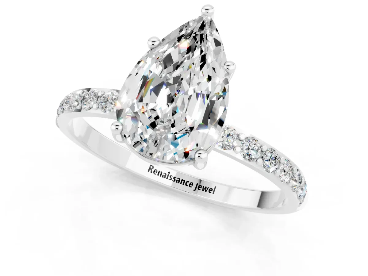 Pear Cut Moissanite Solitaire Ring with Round Pavé Band and Prong Setting Platinum