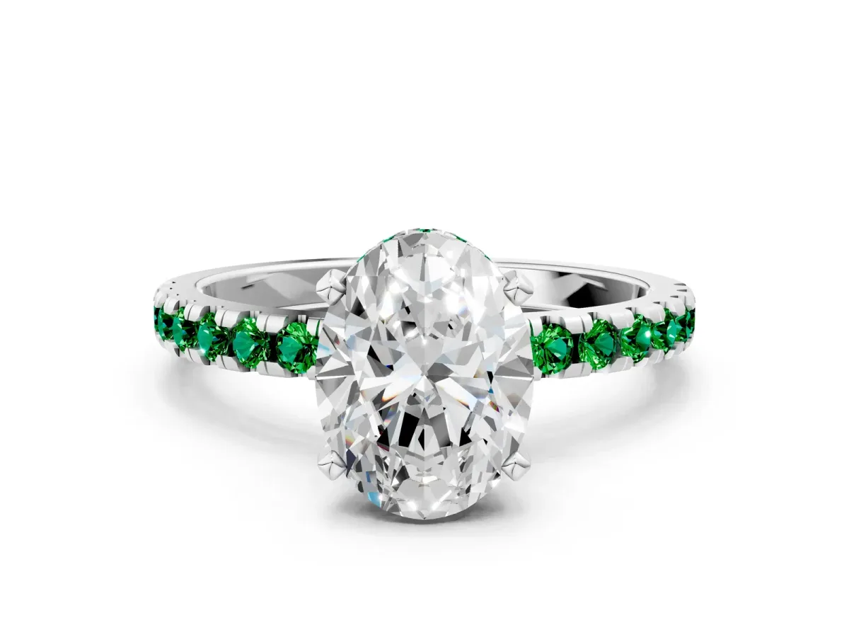 Oval Cut Diamond Solitaire Ring with Round Emerald Pavé Band and Four-Prong Setting Silver