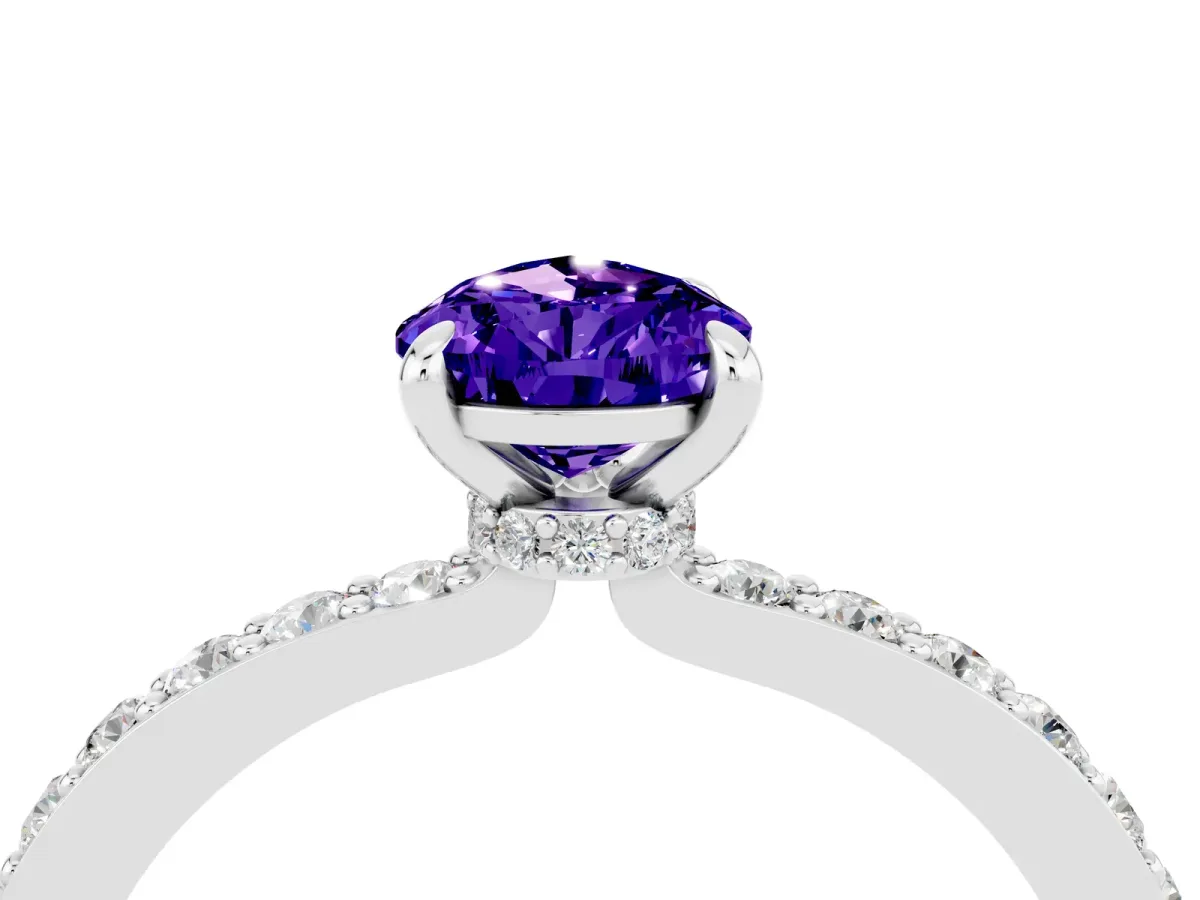 Pear Cut Tanzanite Solitaire Engagement Ring with Pavé Band and Four-Prong Setting Silver