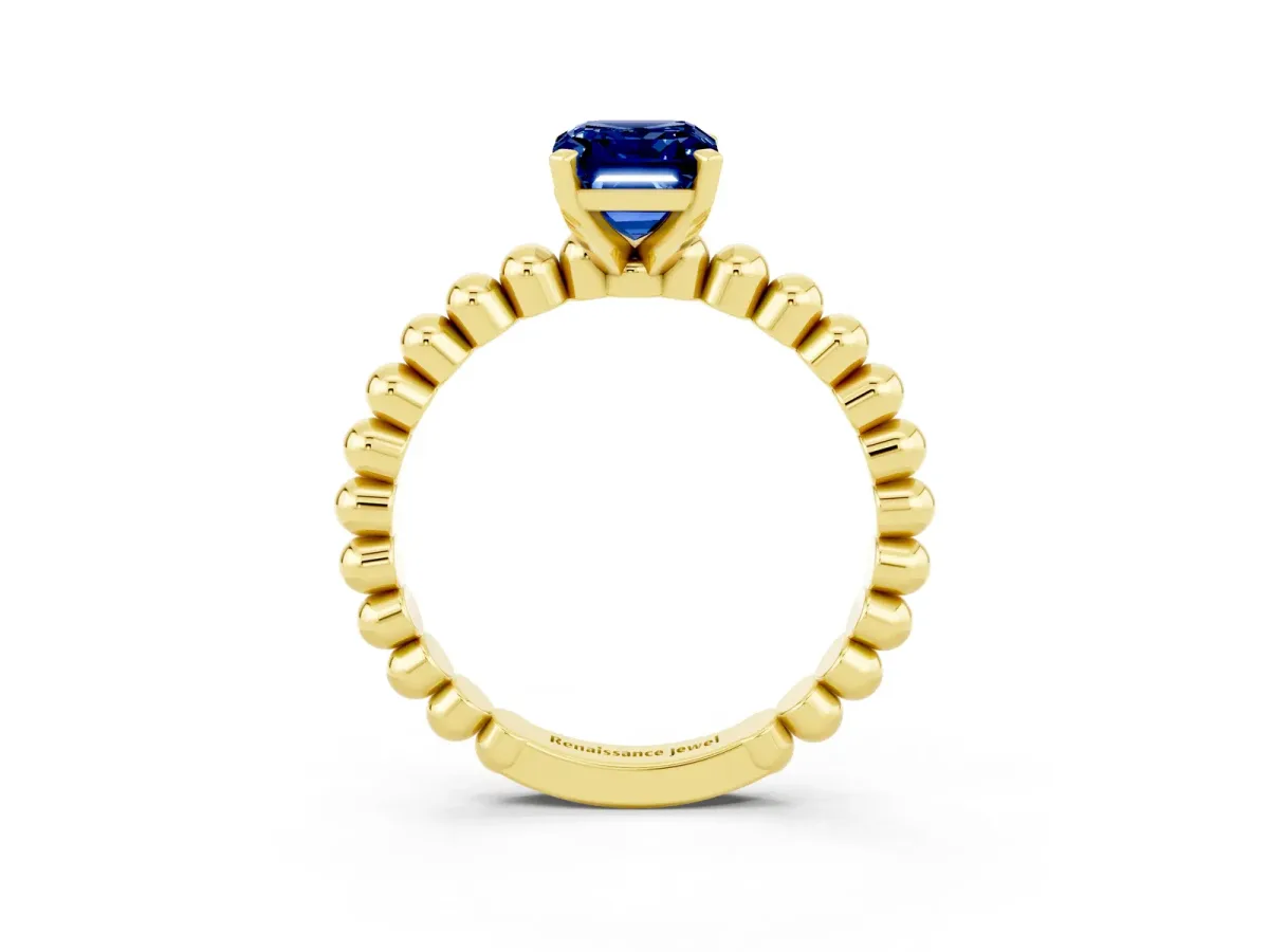 Emerald Cut Blue Sapphire Solitaire Ring with Beaded Band and Prong Setting Yellow gold