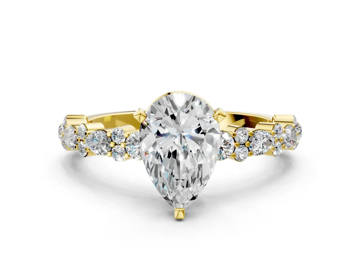 Pear Cut Diamond Side Stone Solitaire Ring with Round and Four-Prong Setting Yellow gold
