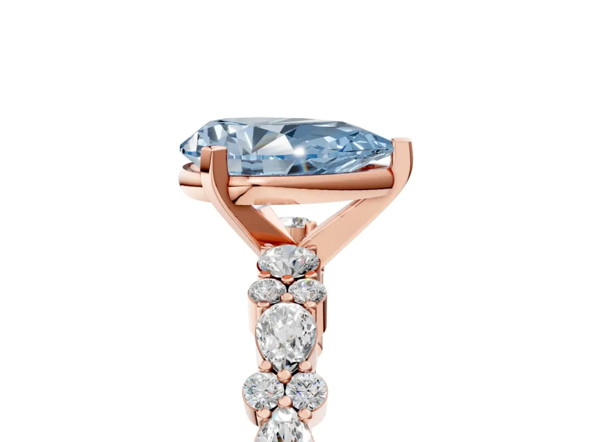 Fancy Blue Pear Cut Diamond Side Stone Solitaire Ring with Round and Four-Prong Setting Rose gold