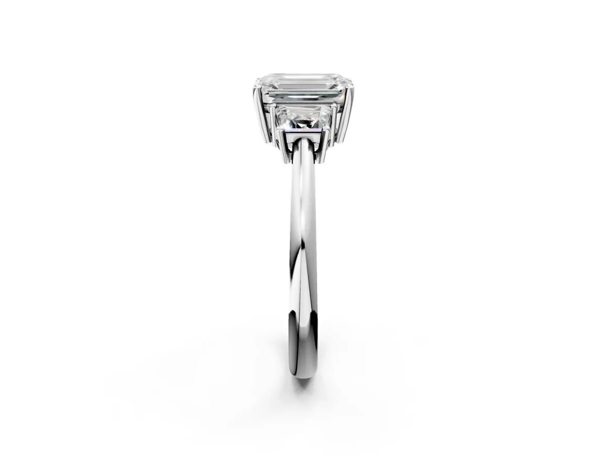 Emerald Cut Diamond Three-Stone Ring with Trapezoid Side Stones and Prong Setting Silver