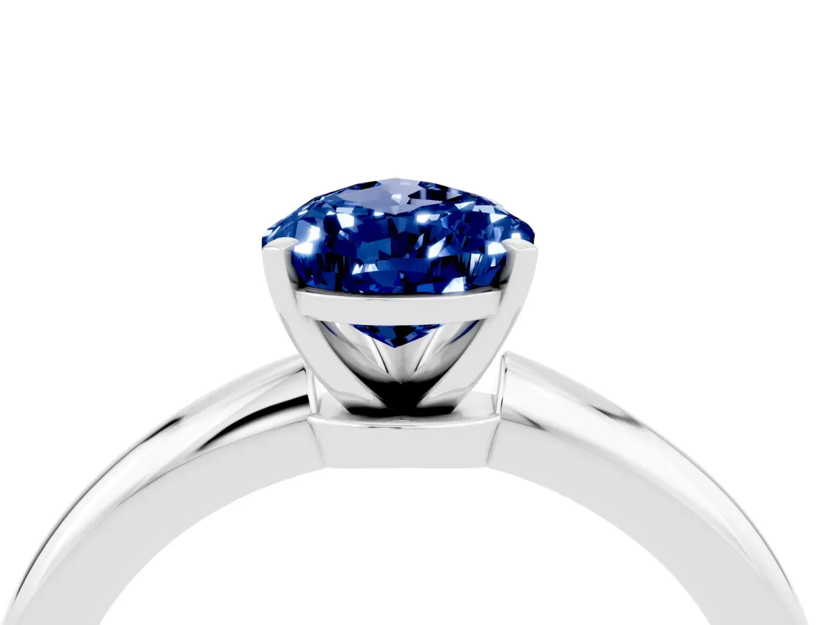 Pear Cut Blue Sapphire Solitaire Ring with Six-Prong Setting and Classic Band Silver