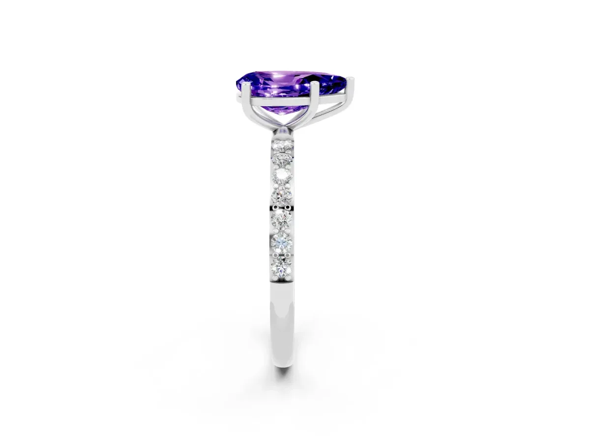 Pear Cut Tanzanite Solitaire Ring with Round Pavé Band and Prong Setting Silver