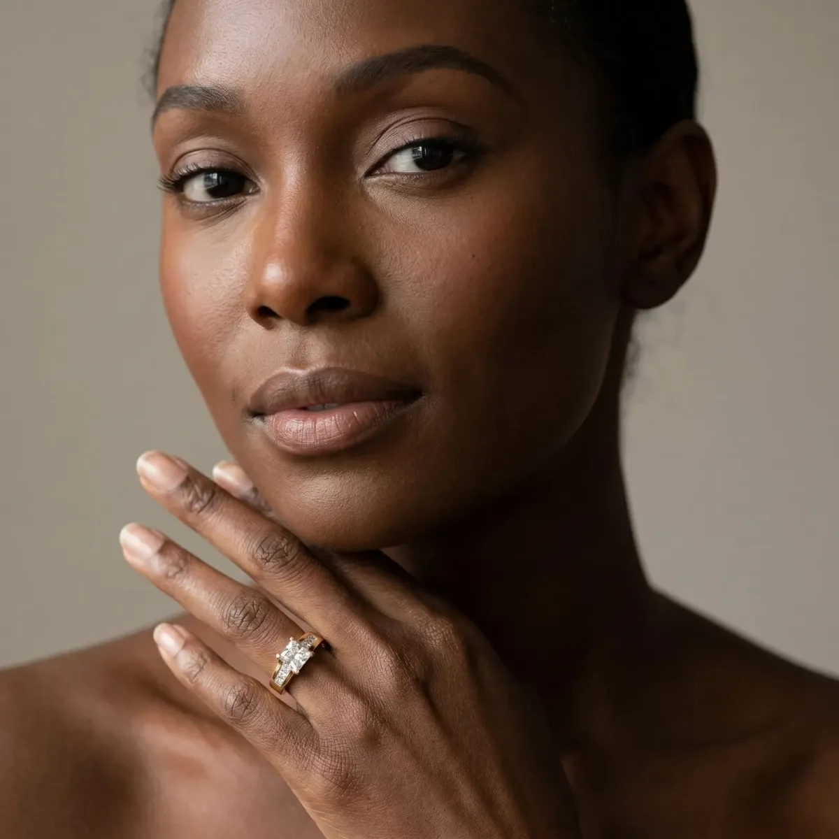 Radiant Cut Cut Channel Set Solitaire Ring with Four-Prong Setting Yellow gold