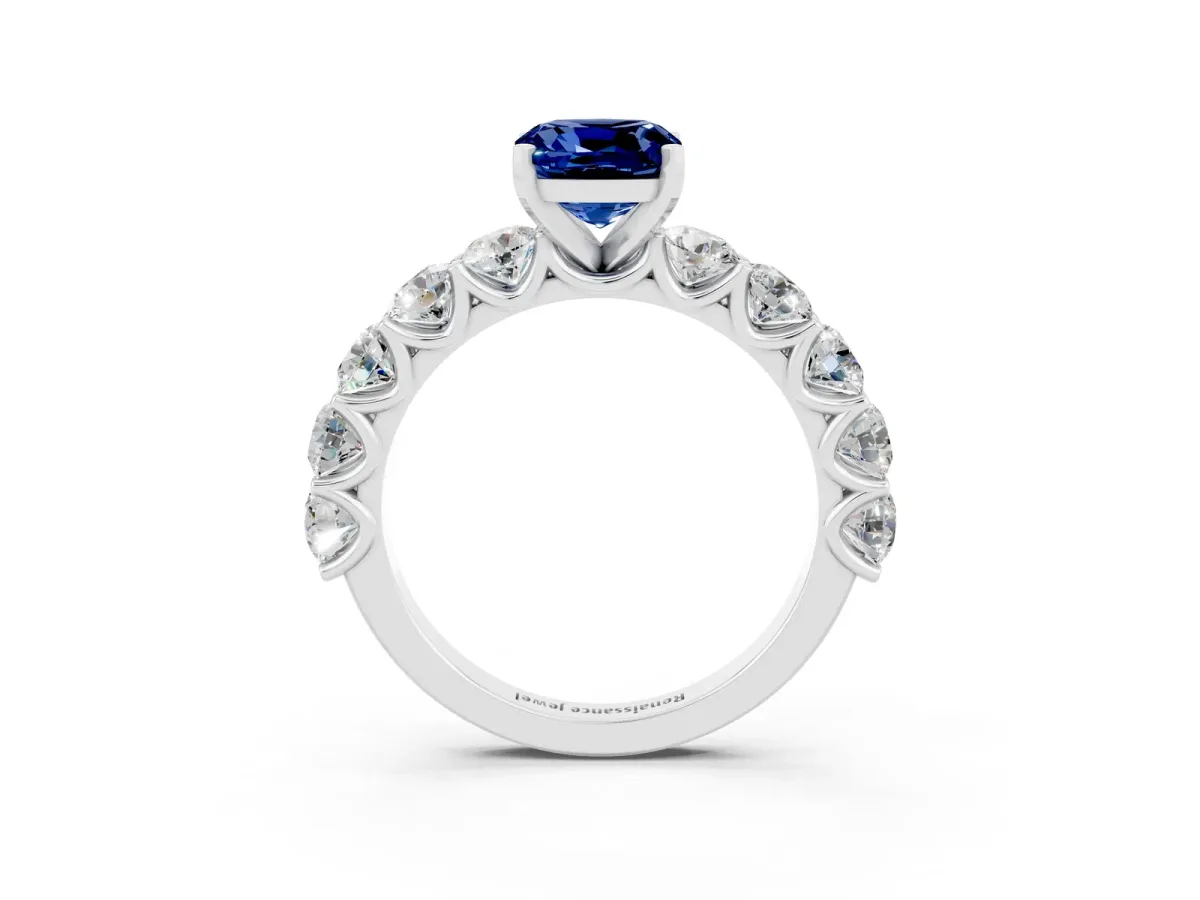Cushion Cut Blue Sapphire Prong Setting with Side Stones on a Pave Band Silver