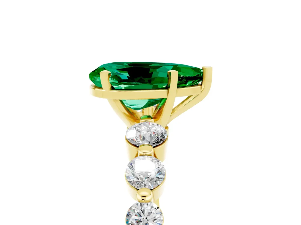 Pear Cut Solitaire Emerald Ring with Pave Band and Four-Prong Setting Yellow gold