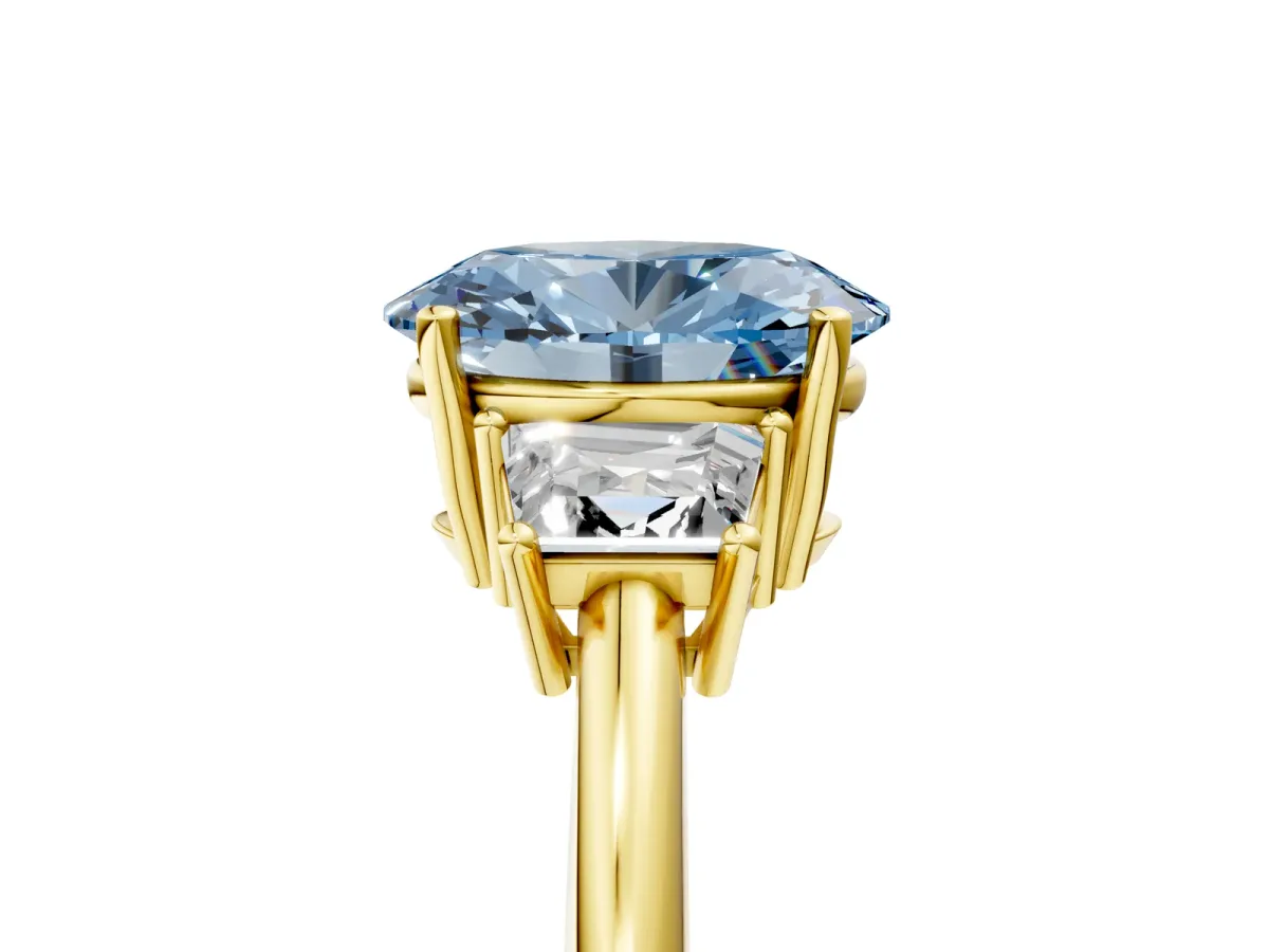 Fancy Blue Oval Cut Diamond Three-Stone Ring with Trapezoid Side Stones and Prong Setting Yellow gold