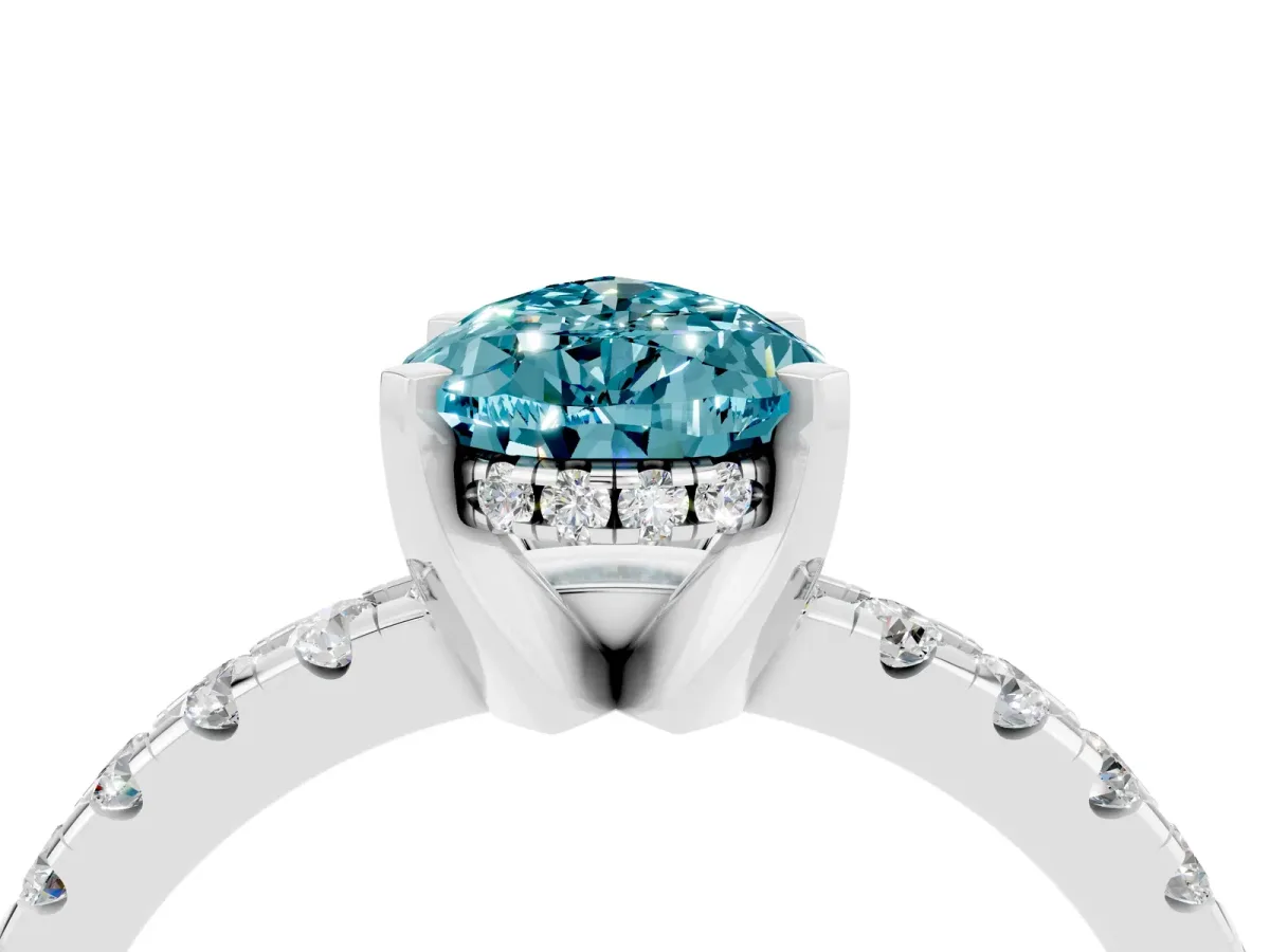 Pear Cut Blue Topaz Solitaire Ring with Round Pavé Band and Four-Prong Setting Silver