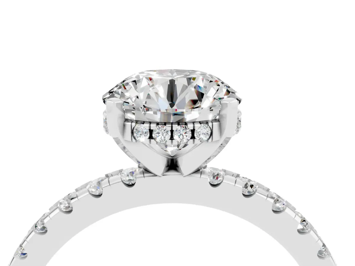 Round Cut Moissanite Solitaire Ring with Round Pavé Band and Four-Prong Setting Silver