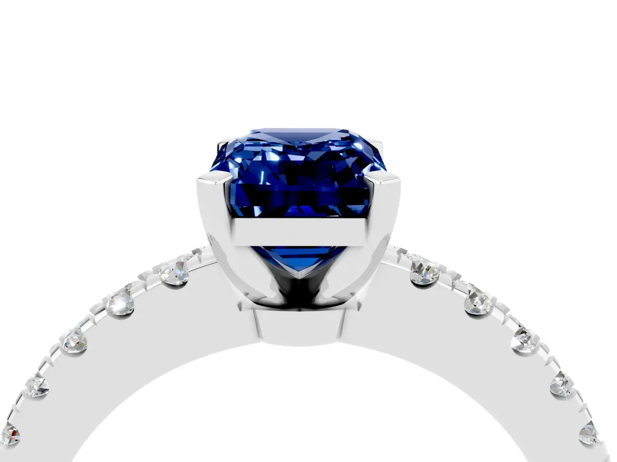 Emerald Cut Solitaire Blue Sapphire with Pavé Band and Four-Prong Setting Silver