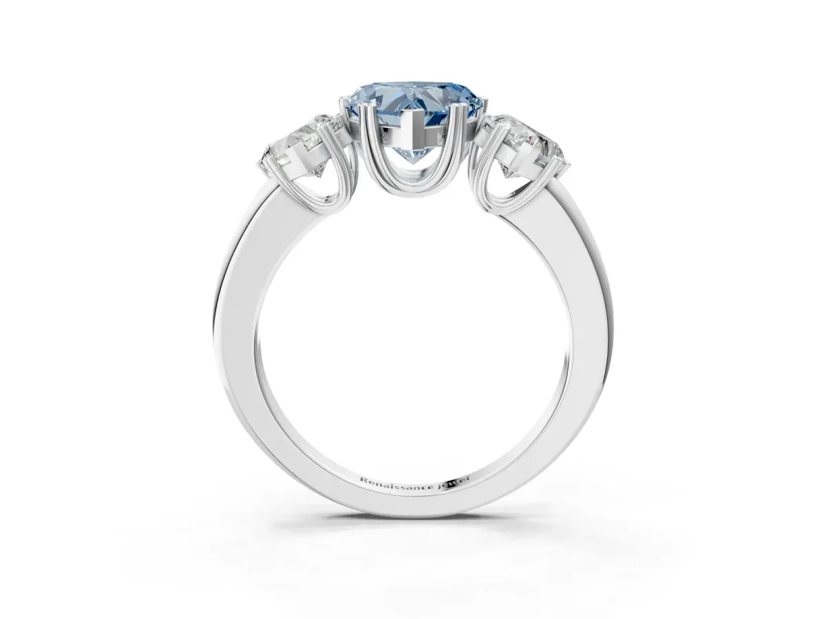 Fancy Blue Three-Stone Heart Cut Cut Diamond Ring with Channel Set Band and Four-Prong Setting Silver