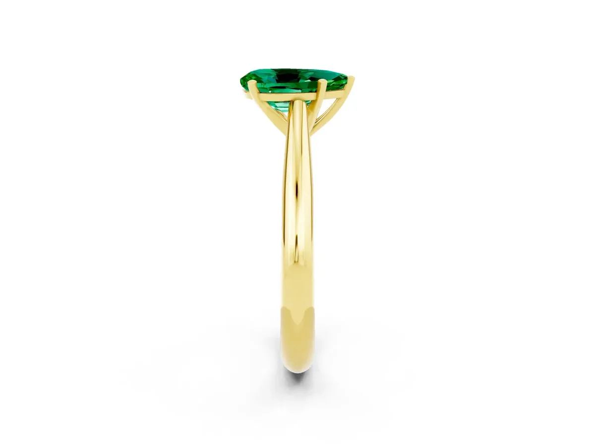Pear Cut Emerald Solitaire Engagement Ring with Cathedral Setting and Four-Prong Mount Yellow gold