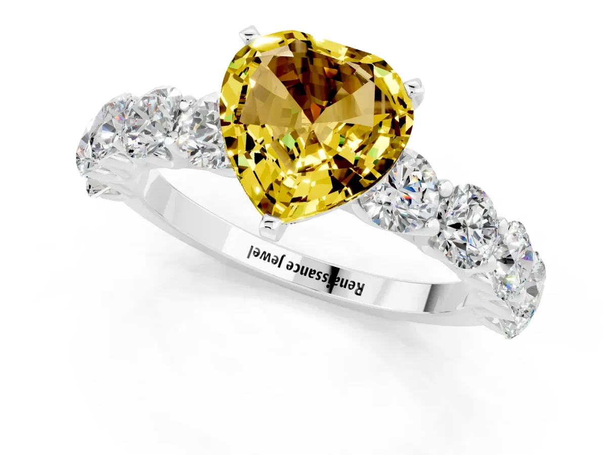 Heart Cut Yellow Sapphire Prong Setting with Side Stones on a Pave Band Silver