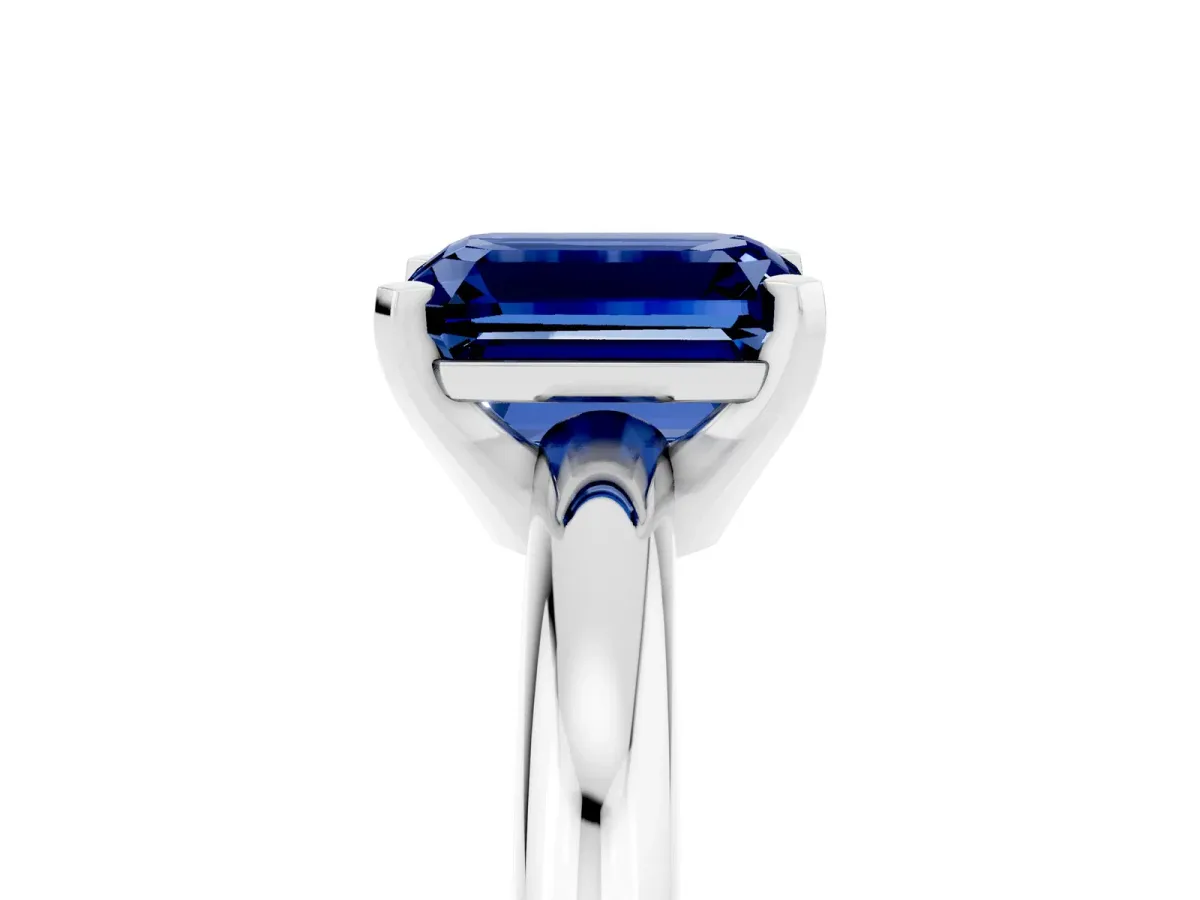 Emerald Cut Blue Sapphire Solitaire Engagement Ring with Round Band and Four-Prong Setting Silver