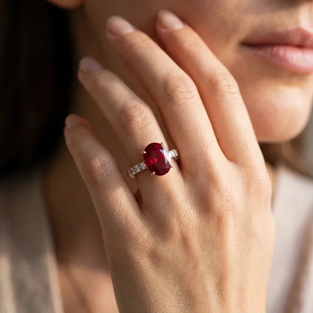 Oval Cut Ruby Solitaire Ring with Round Pavé Band and Four-Prong Setting Rose gold