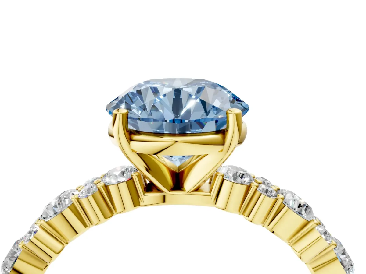 Fancy Blue Round Cut Diamond Side Stone Solitaire Ring with Round and Four-Prong Setting Yellow gold