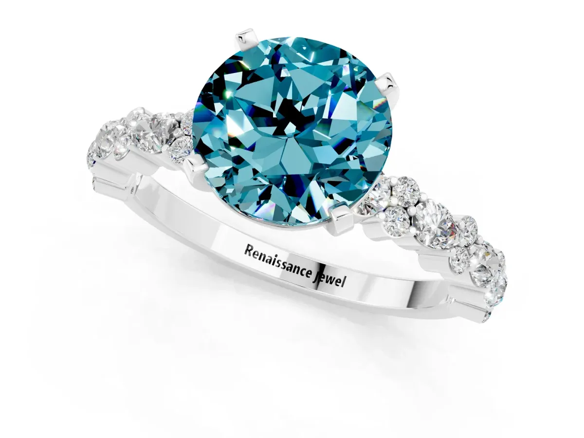 Round Cut Blue Topaz Side Stone Solitaire Ring with Round and Four-Prong Setting White gold