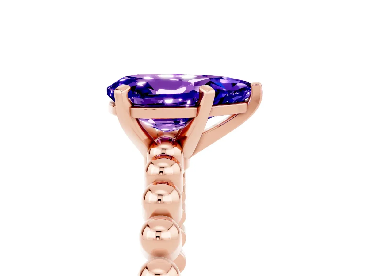 Pear Cut Tanzanite Solitaire Ring with Beaded Band and Prong Setting Rose gold