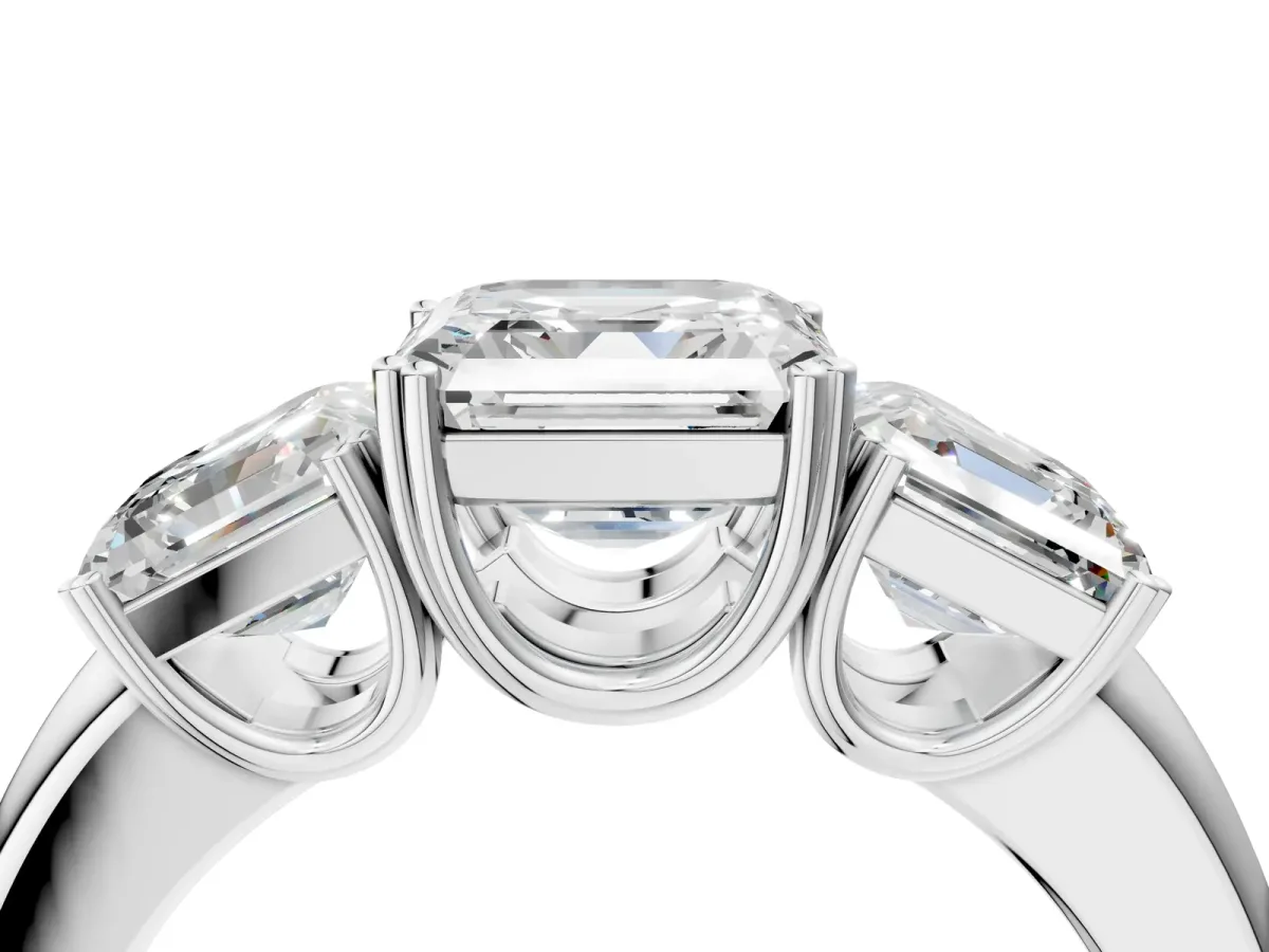 Three-Stone Emerald Cut Cut Diamond Ring with Channel Set Band and Four-Prong Setting Platinum