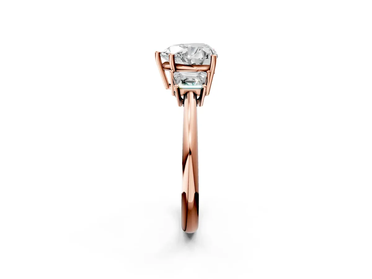 Heart Cut Diamond Three-Stone Ring with Trapezoid Side Stones and Prong Setting Rose gold