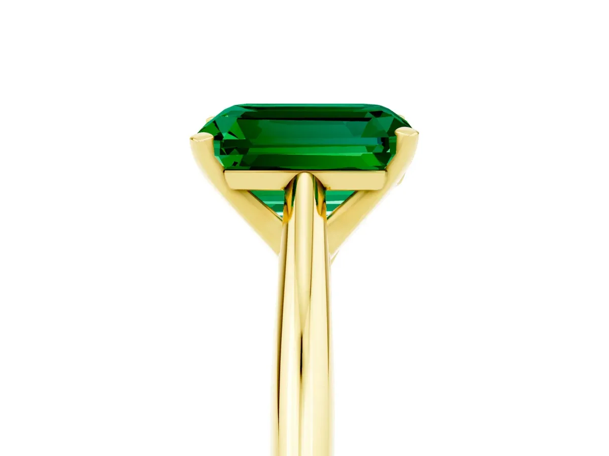 Emerald Cut Emerald Solitaire Engagement Ring with Cathedral Setting and Four-Prong Mount Yellow gold