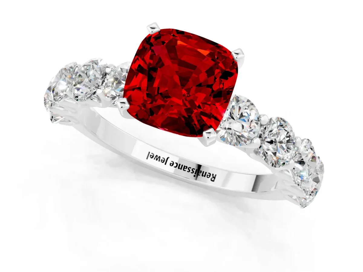 Cushion Cut Ruby Prong Setting with Side Stones on a Pave Band Platinum