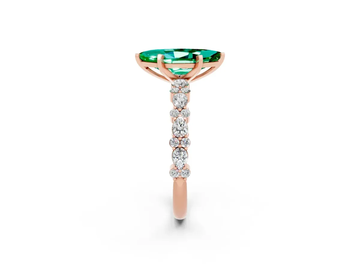 Marquise Cut Emerald Side Stone Solitaire Ring with Round and Four-Prong Setting Rose gold