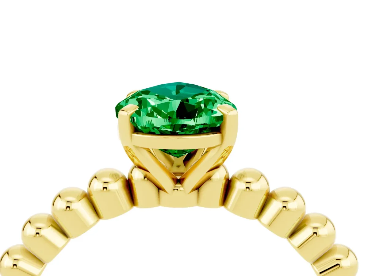 Pear Cut Emerald Solitaire Ring with Beaded Band and Prong Setting Yellow gold