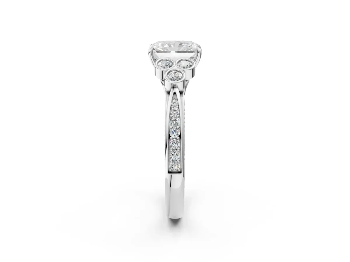 Radiant Cut Cut Diamond Engagement Ring with Bezel Set Round Side Stones and Prong Setting Platinum