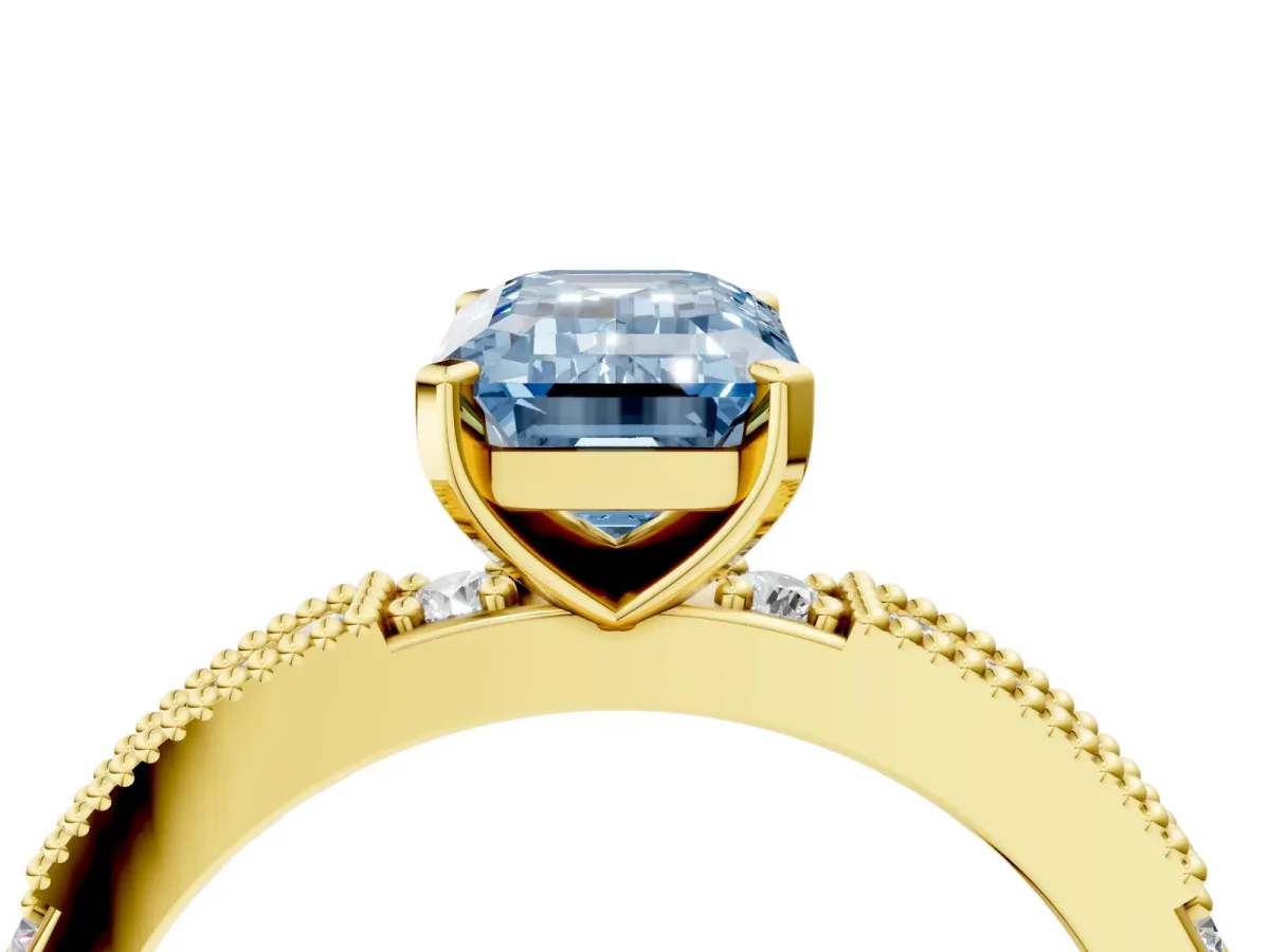 Fancy Blue Emerald Cut Solitaire with Pavé Band and Four-Prong Setting Yellow gold