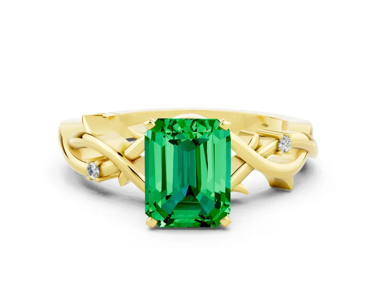 Emerald Cut Emerald Solitaire Ring with Twisted Band and Prong Setting Yellow gold