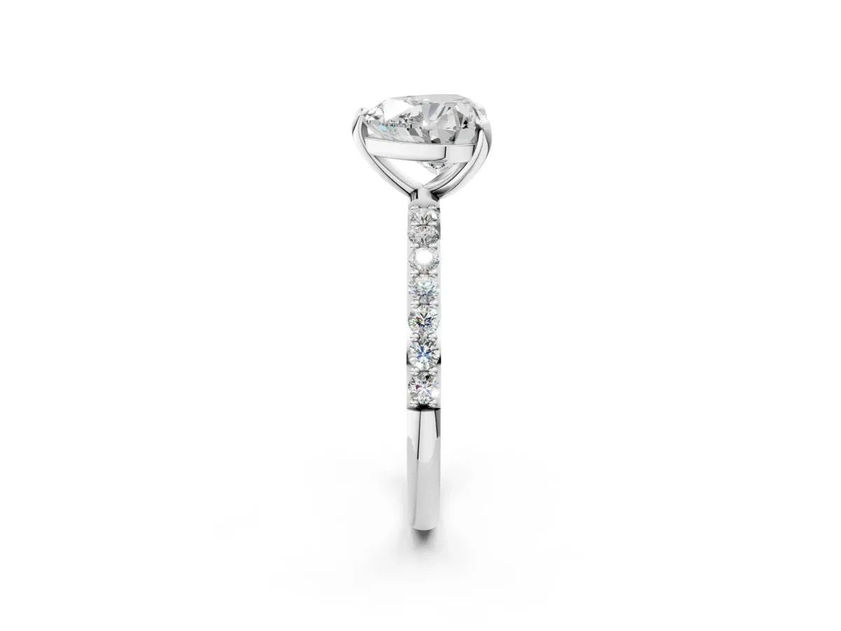 Heart Cut Diamond Solitaire Ring with Round Pavé Band and Prong Setting Silver