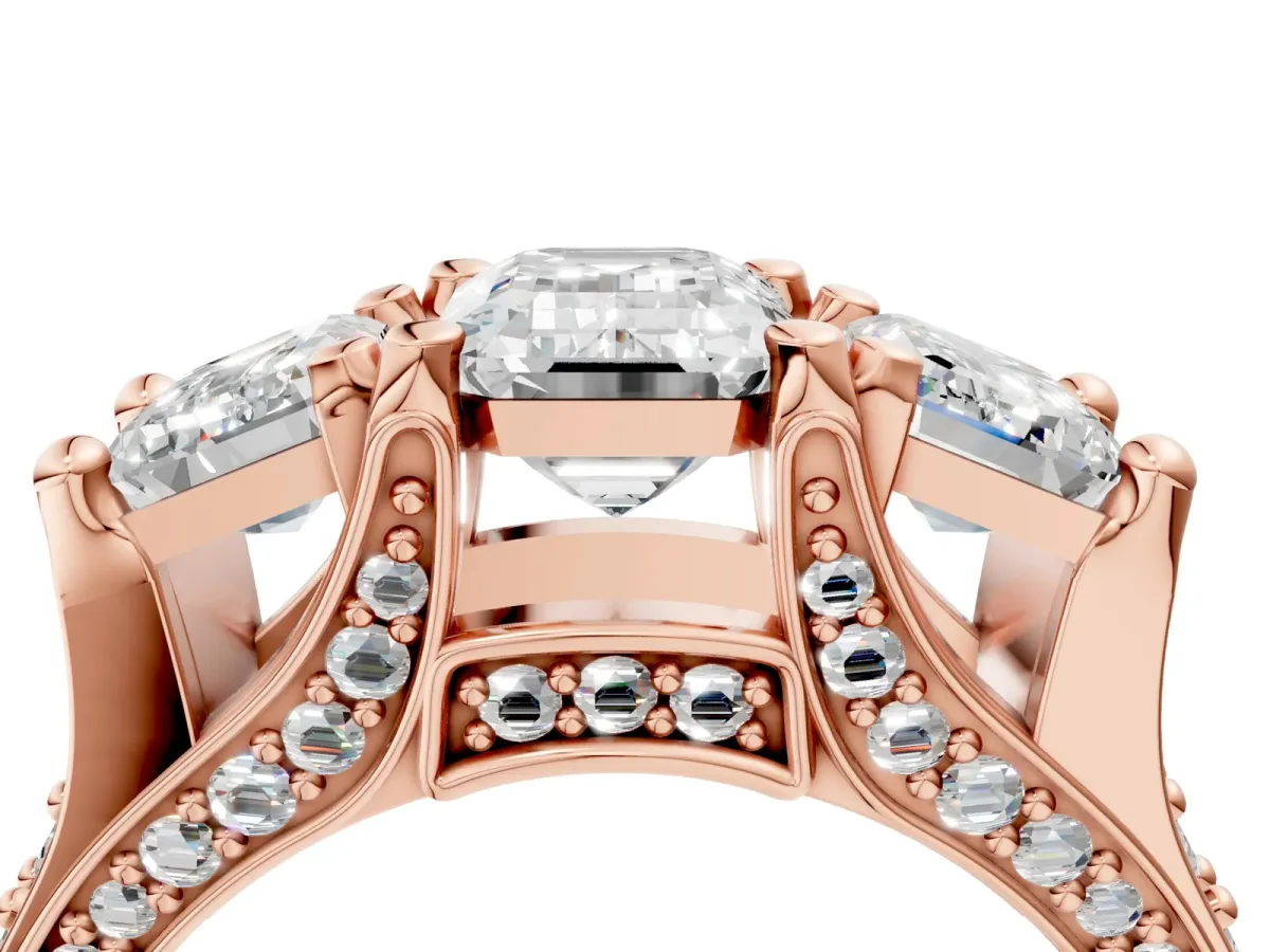 Emerald Cut Diamond Three-Stone Ring with Channel Set Band and Four-Prong Setting Rose gold