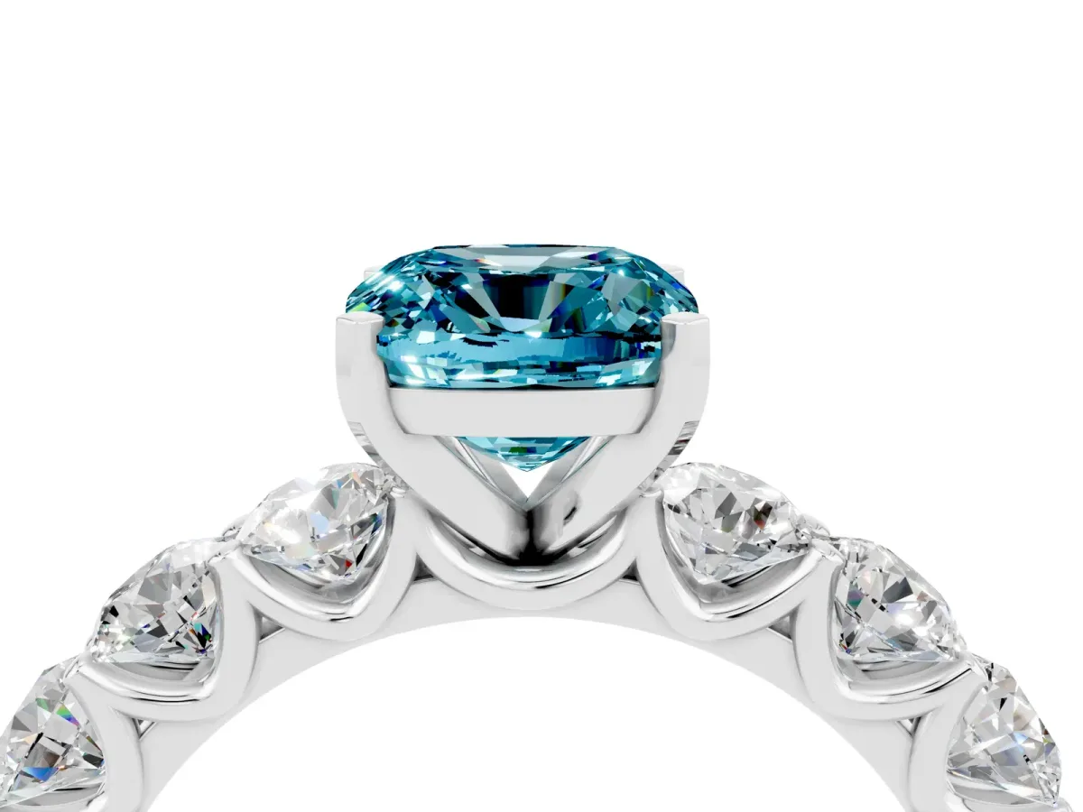 Cushion Cut Blue Topaz Prong Setting with Side Stones on a Pave Band Silver